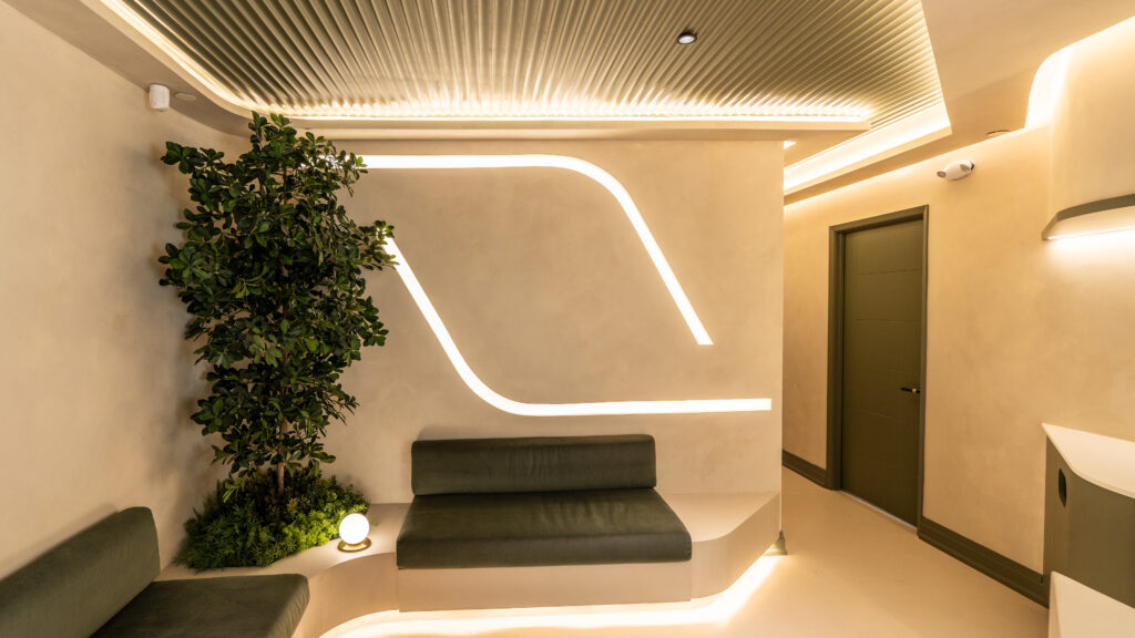 Seating and indoor greenery in the AuraWell clinic waiting area