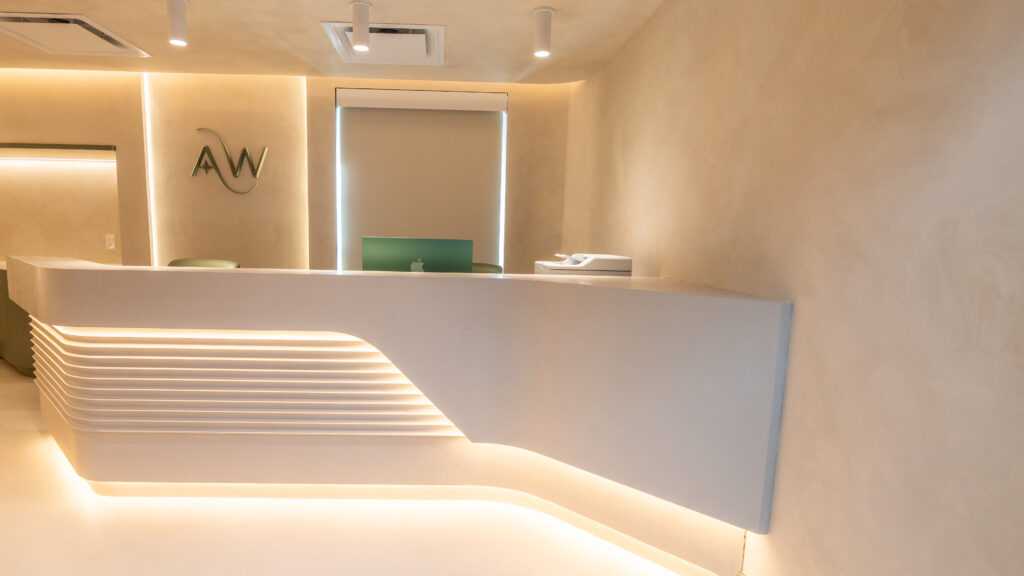 Illuminated reception desk at AuraWell Health in Woodbridge