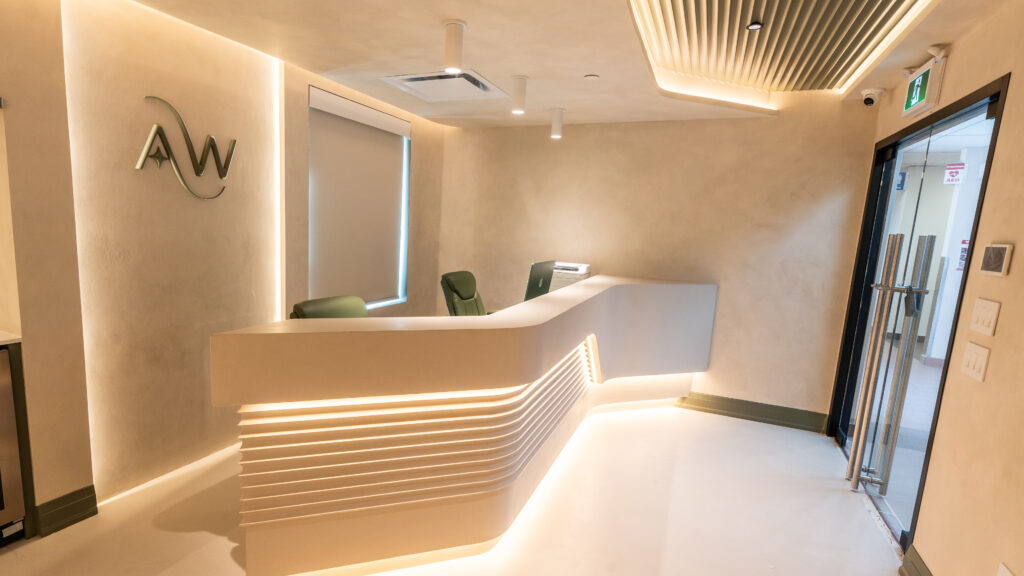 Reception desk beside the entrance to AuraWell Health